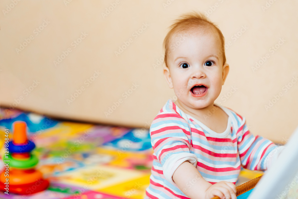 the kid is very happy when being photographed the kid is very happy when being photographed