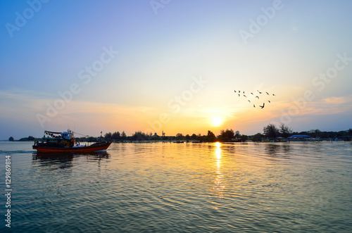 Fishing boat when sunset (Selective focus. Focus at the boat only) © shahrilkhmd