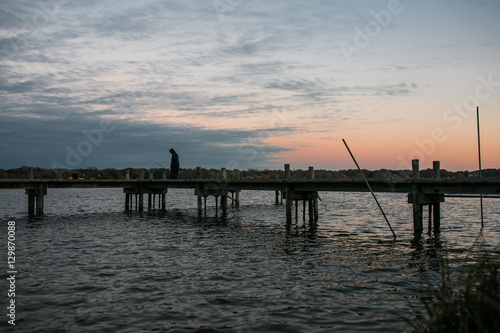 Fisher Man on a Bridge During Sunset At White Rock Lake, Dallas © nat693