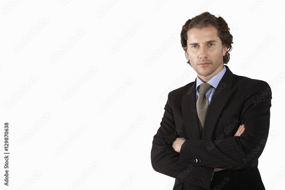 portrait of businessman with arms crossed on white background portrait of businessman with arms crossed on white background