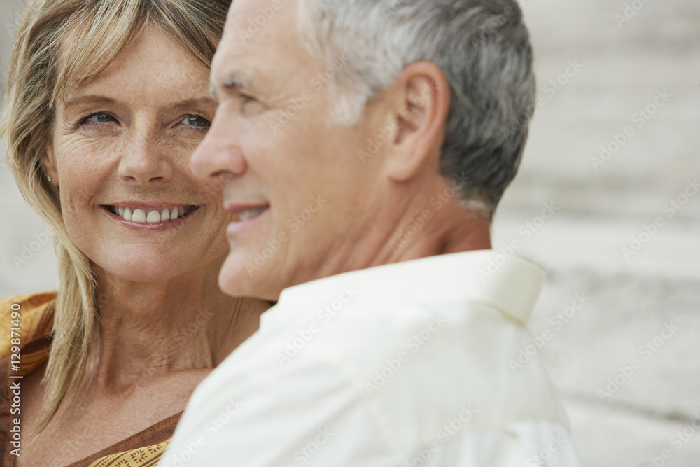 Closeup of happy middle aged woman looking at man in Rome, Italy Closeup of happy middle aged woman looking at man in Rome, Italy