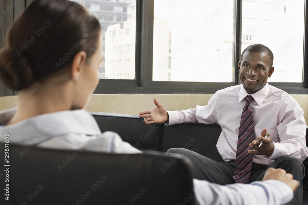 Multiethnic business colleagues having a discussion in a meeting Multiethnic business colleagues having a discussion in a meeting
