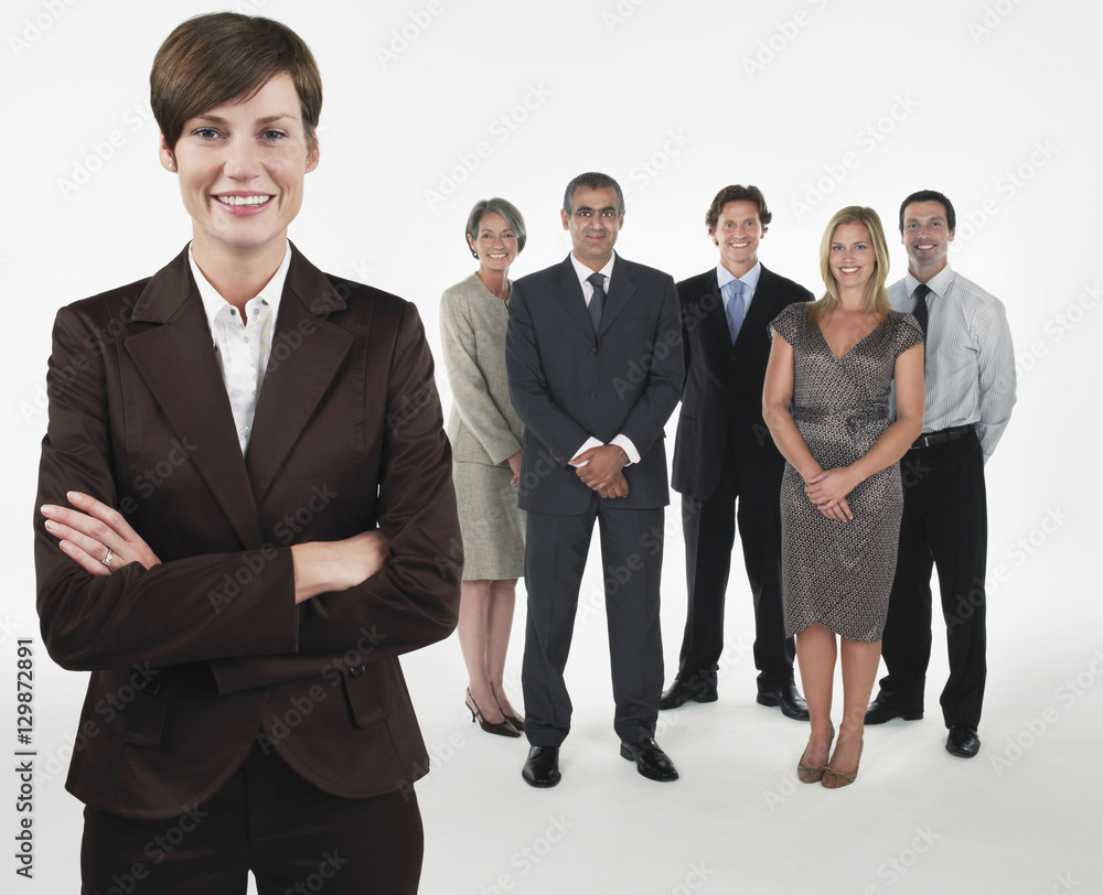Portrait of a smiling businesswoman with team against white background Portrait of a smiling businesswoman with team against white background