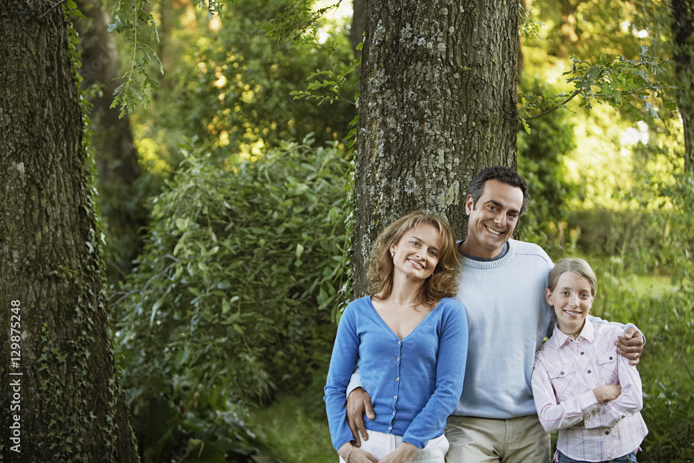 Portrait of happy parents with daughter in park Portrait of happy parents with daughter in park