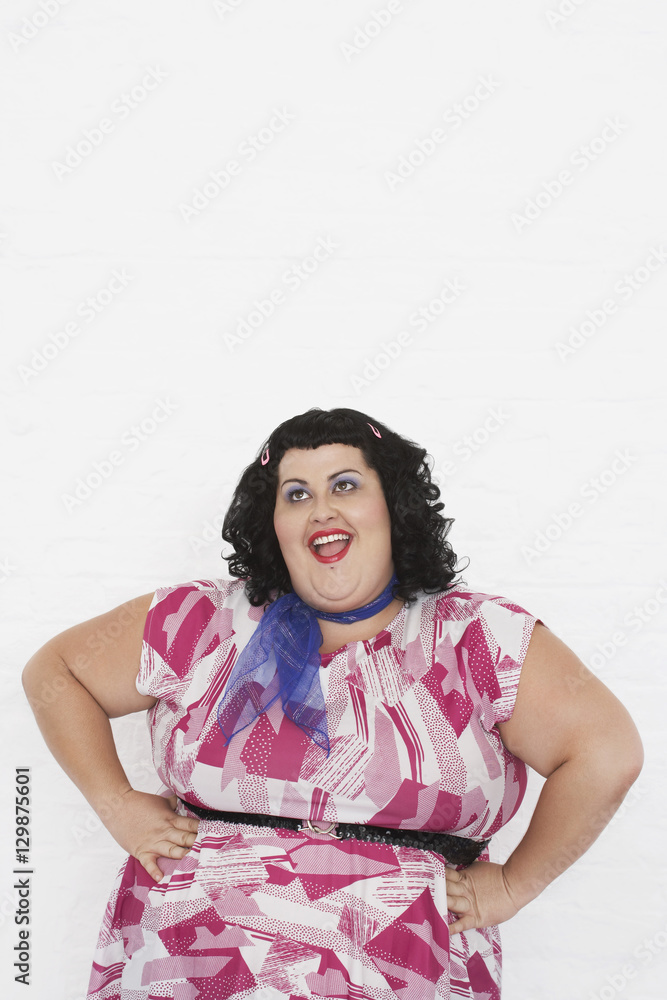 Portrait of an overweight woman posing against white background Portrait of an overweight woman posing against white background