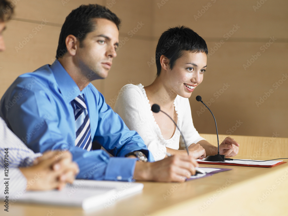 Young business people giving presentation in conference room Young business people giving presentation in conference room