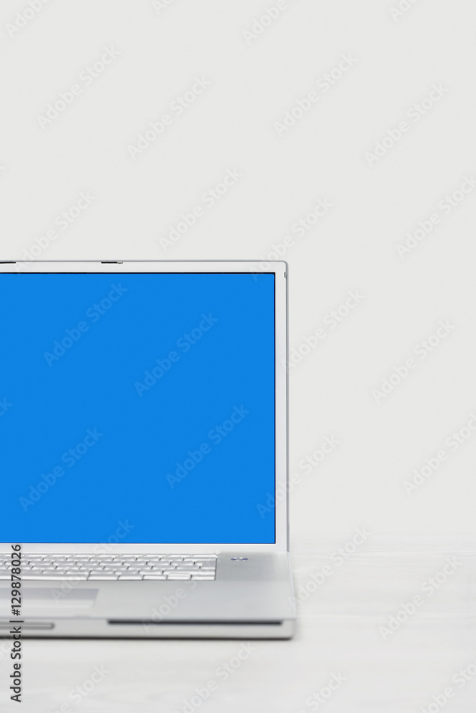 Open laptop with blue screen over white background Open laptop with blue screen over white background