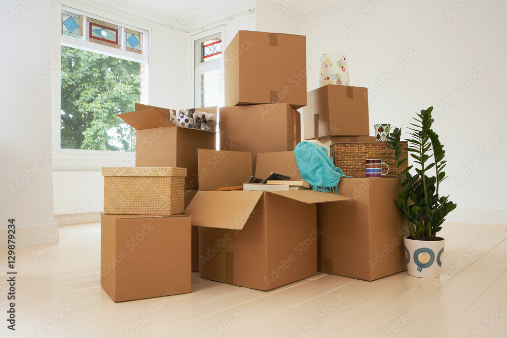 Stack of moving boxes in new house Stack of moving boxes in new house