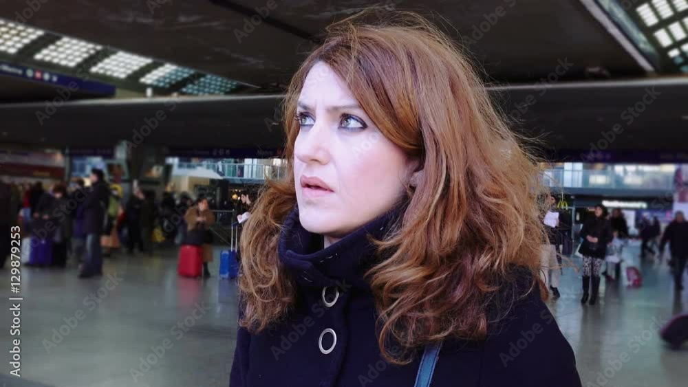 young woman waiting the train departure in a train station young woman waiting the train departure in a train station