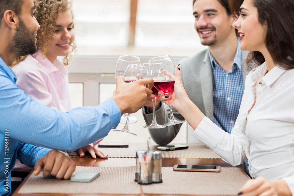 Young Business People Group Sitting At Cafe Table Toasting, Hold Wine Glasses, Friends Cheers Happy Communication Event Celebration Young Business People Group Sitting At Cafe Table Toasting, Hold Wine Glasses, Friends Cheers Happy Communication Event Celebration