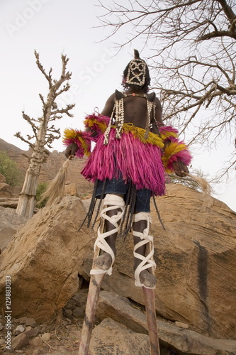 Masked ceremonial Dogon dancer on stilts near Sangha, Bandiagara escarpment, Dogon area, Mali, West Africa
