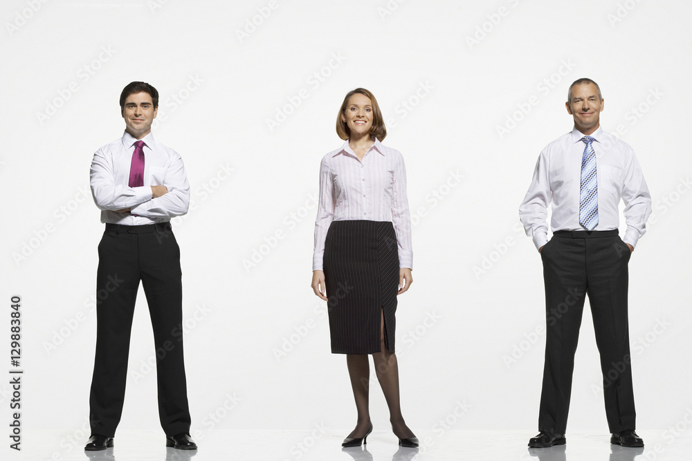 Full length portrait of businesspeople standing side by side against white background Full length portrait of businesspeople standing side by side against white background