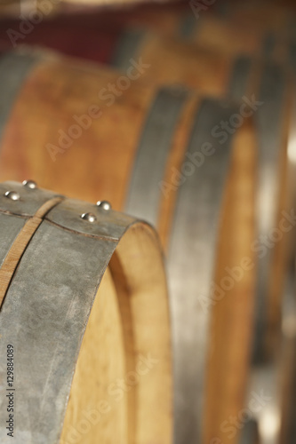 Closeup of wine casks in cellar