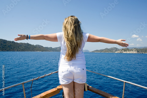 Woman sailing in a yacht