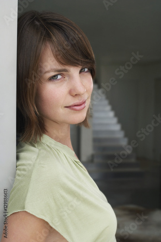 Portrait of a beautiful woman leaning on wall Free Download Portrait of a beautiful woman leaning on wall - GFXLoad