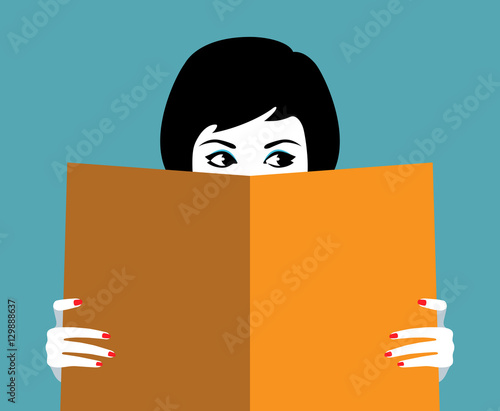 Beautiful girl face behind big book