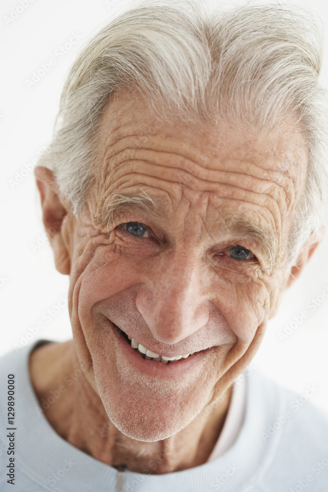Closeup portrait of happy old man isolated over white background Closeup portrait of happy old man isolated over white background