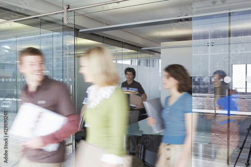 Photography Multiethnic blurred office workers leaving conference room