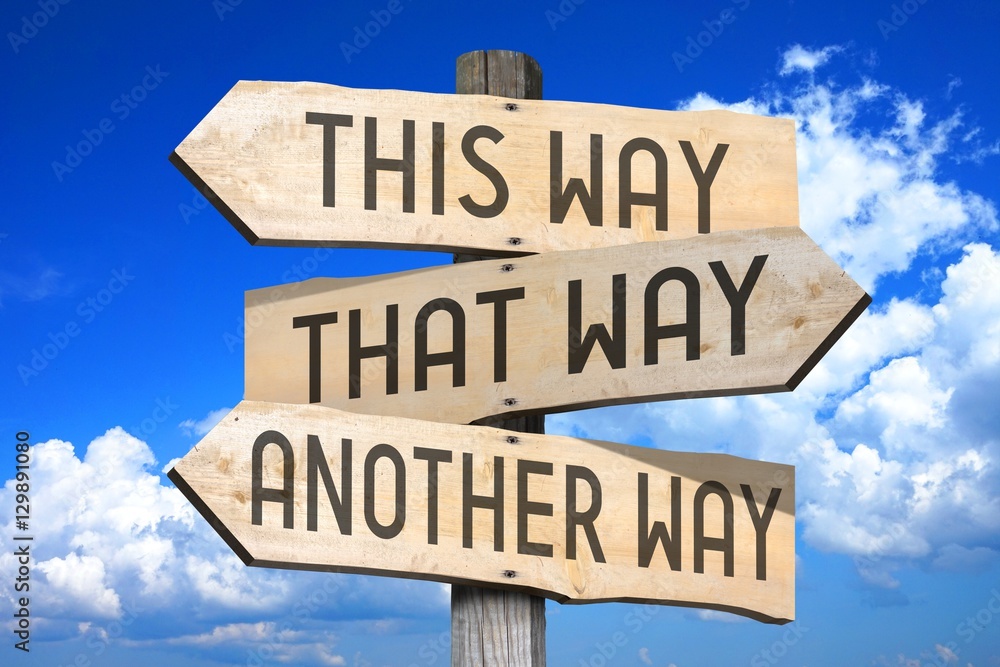 This way, that way, another way - wooden signpost Stock Photo