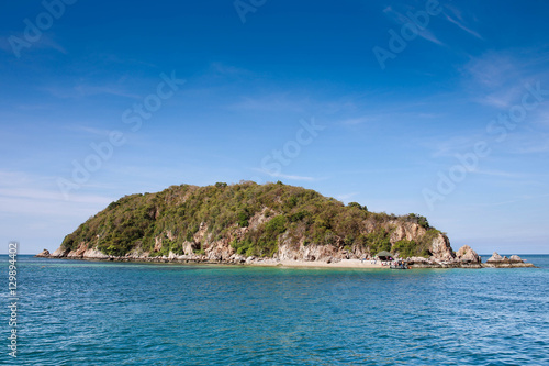 Small island in the middle of the sea and blue sky. © Sirichok