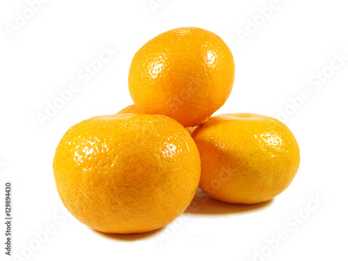 Heap of ripe bright color oranges isolated on white background  close-up 