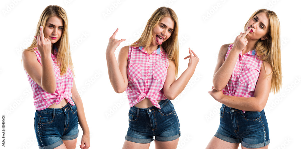 Fototapeta premium Blonde girl making horn gesture