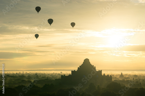 Balloons over Dhammayangyi pagoda at Bagan ancient city in a mor