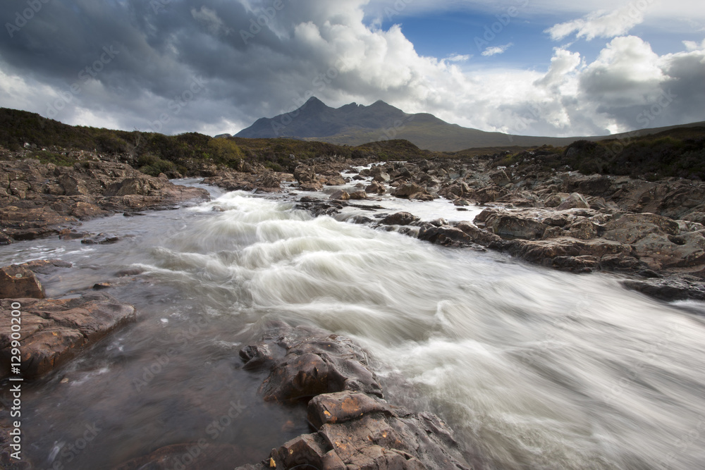 River Sligachan tumbling over rocks with Sgurr nan Gillean in distance, Glen Sligachan, Isle of Skye, Highlands, Scotland River Sligachan tumbling over rocks with Sgurr nan Gillean in distance, Glen Sligachan, Isle of Skye, Highlands, Scotland
