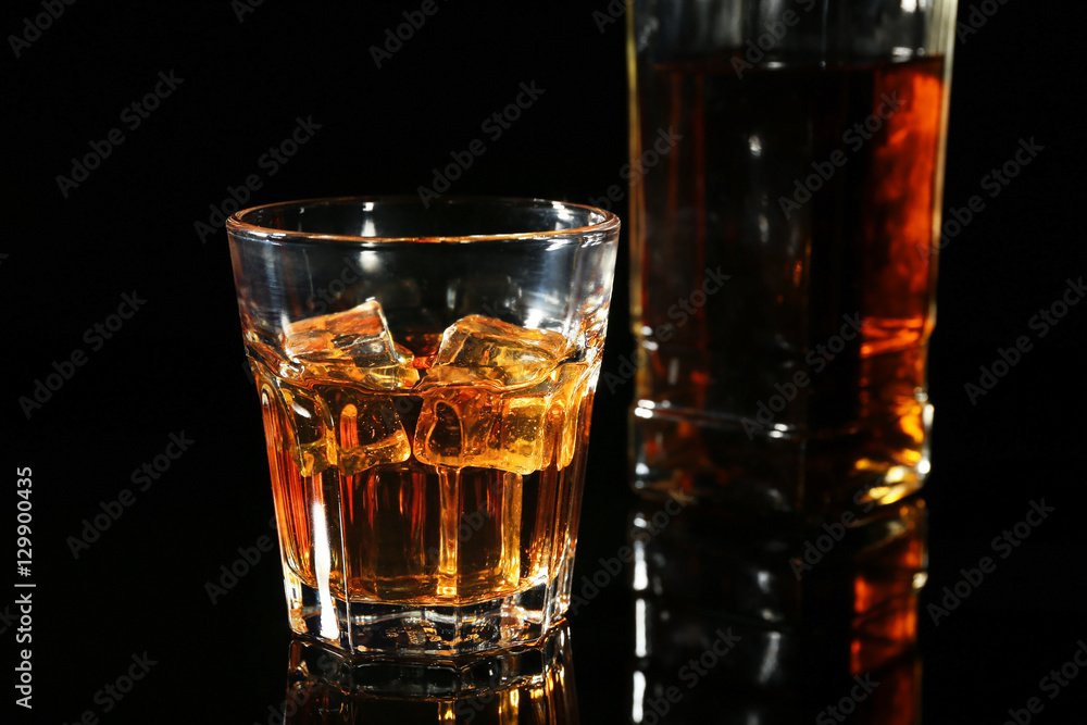 Glass of whisky on dark background