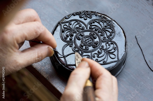 Black Kengtung style lacquerware being made at U Mu Ling Ta, a fifth-generation shop specialising in lacquerware in Kengtung (Kyaingtong), Shan State photo