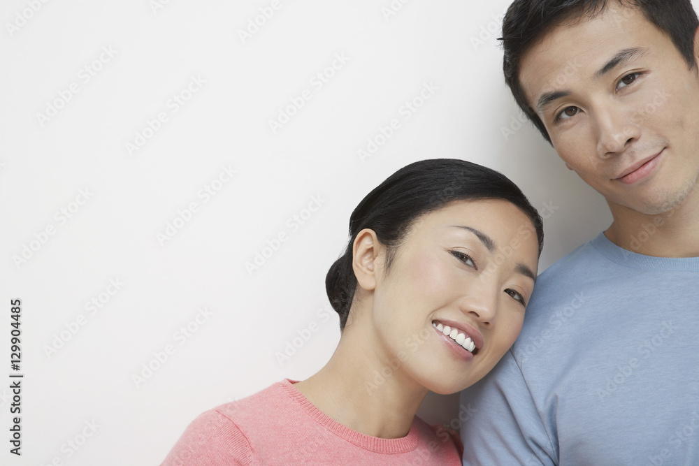 Portrait of a loving man and woman against white background Portrait of a loving man and woman against white background