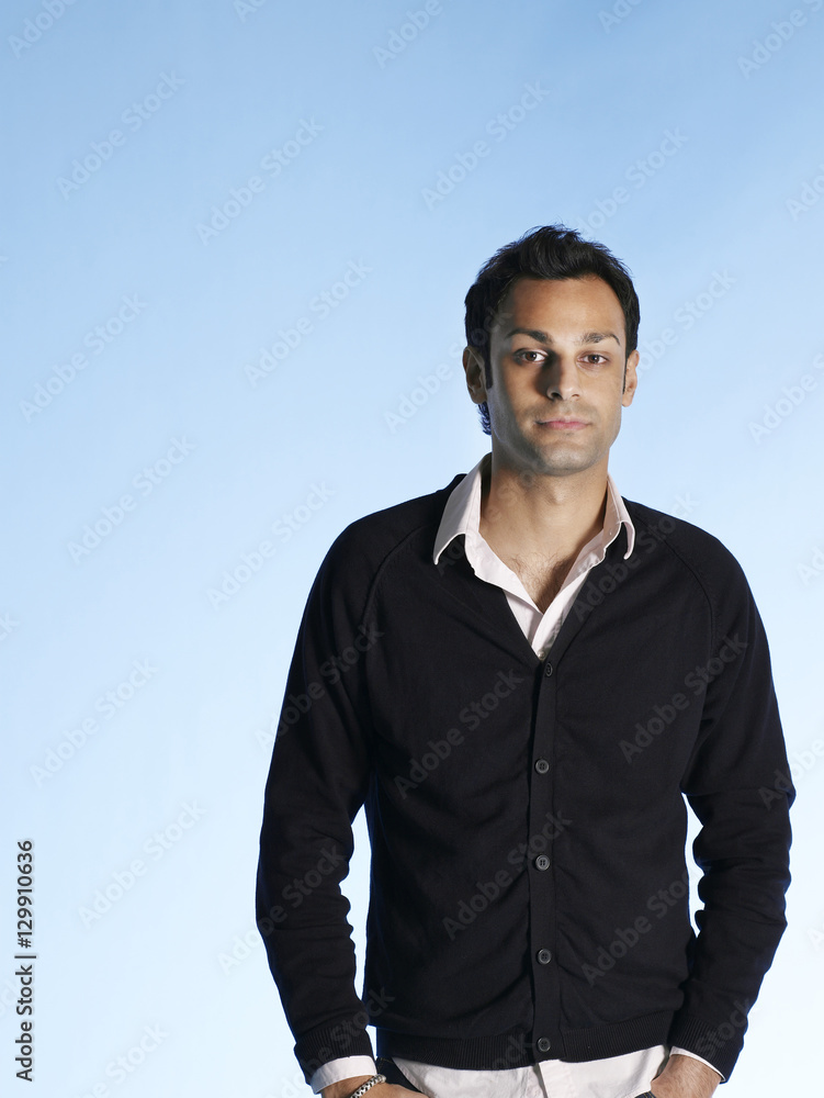 Portrait of handsome young man isolated on blue background Portrait of handsome young man isolated on blue background