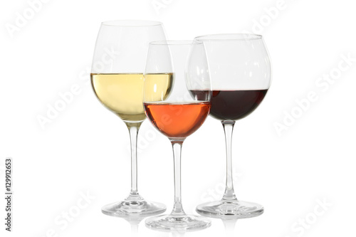 Three glasses with tasty wine on white background