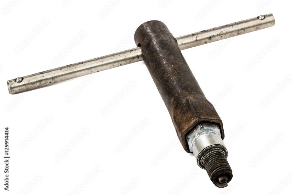 Old wrench key and spark plug, isolated on white, with clipping Old wrench key and spark plug, isolated on white, with clipping