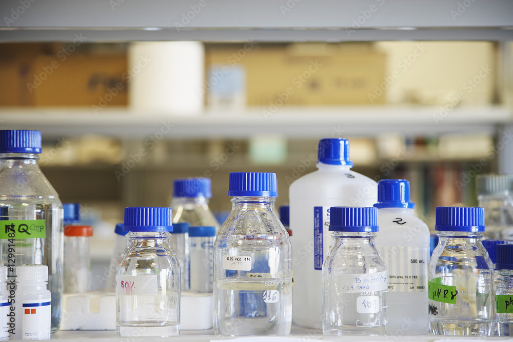 Closeup of empty chemical bottles on table in laboratory Closeup of empty chemical bottles on table in laboratory