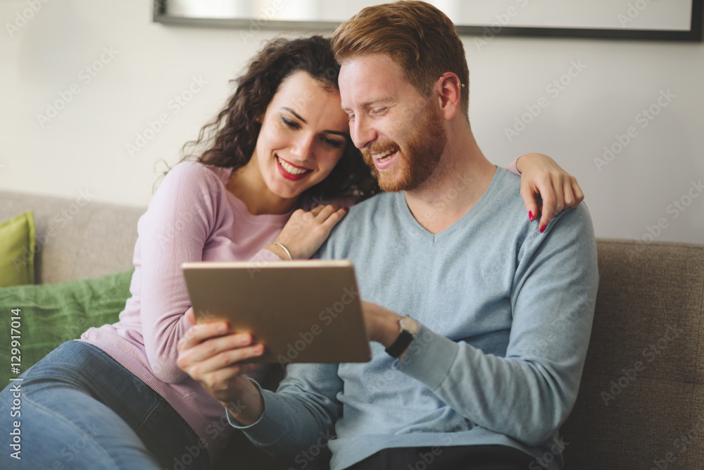 Couple hugging and smiling at home Couple hugging and smiling at home
