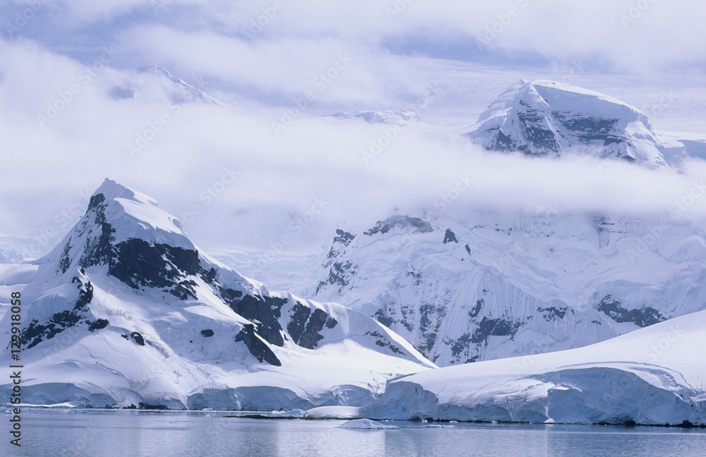 Antarctica Snow covered mountains and icebergs