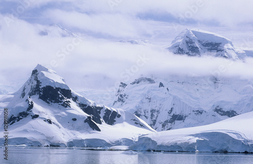 Antarctica Snow covered mountains and icebergs © moodboard