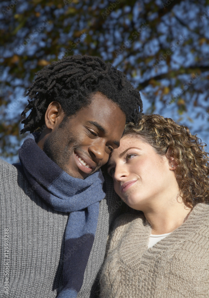 Romantic young multiethnic couple at park Romantic young multiethnic couple at park