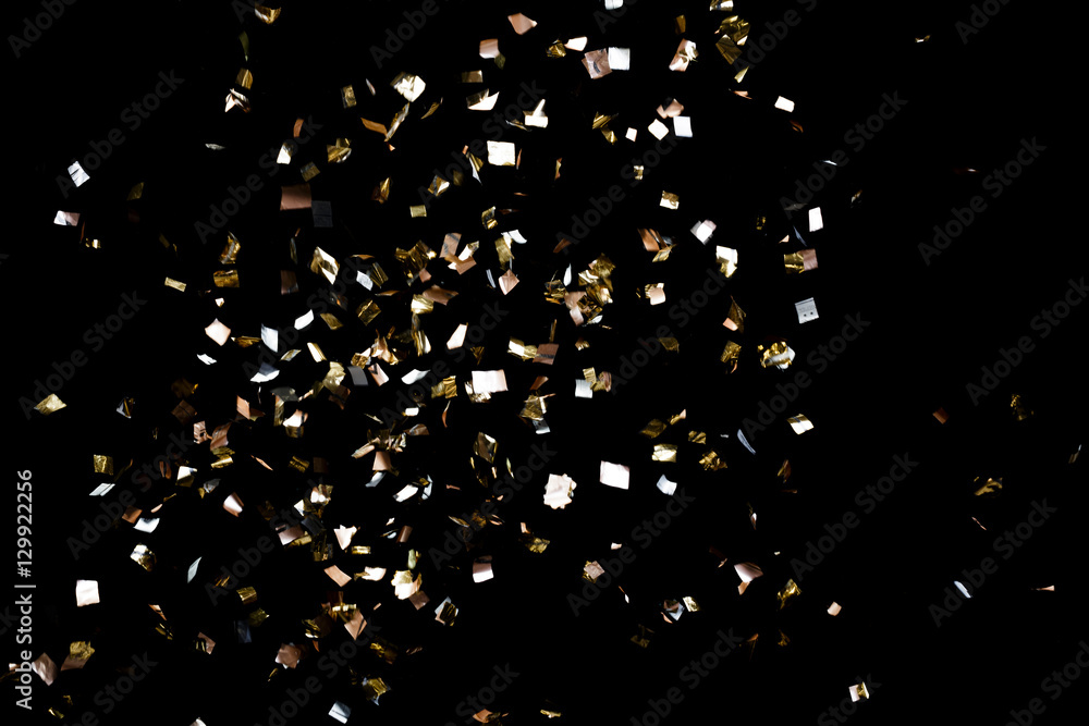 Golden confetti on black background - obrazy, fototapety, plakaty 