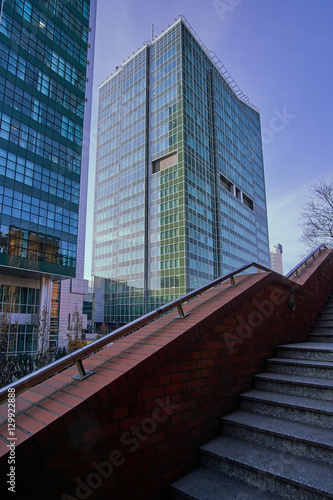 Stone staircase and modern office buildings in the city center to Poznan.