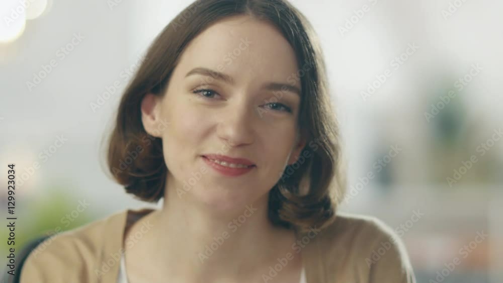 Camera Focuses on a Beautiful Smiling Brunette. She is Charming. Her Background is out of Focus. Shot on RED Cinema Camera in 4K (UHD). Camera Focuses on a Beautiful Smiling Brunette. She is Charming. Her Background is out of Focus. Shot on RED Cinema Camera in 4K (UHD).