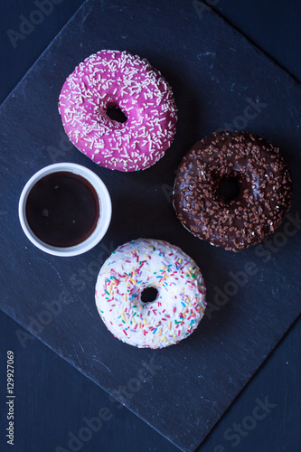 donuts and coffee on a black background