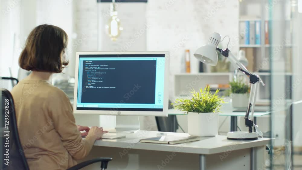 Young Creative Woman Developer Writes Code on Her Desktop Computer. She ...
