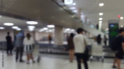 Blurry abstract Travelers waiting for their luggage at the bagga