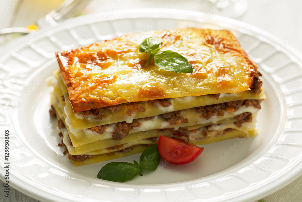 Traditional Italian lasagna made with minced beef. Side view Traditional Italian lasagna made with minced beef. Side view