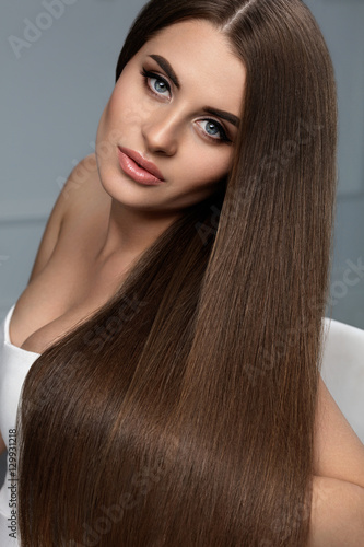 Beautiful Hair. Woman Model With Glossy Straight Long Hair.