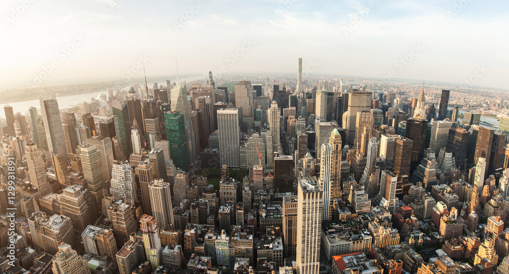 New York City Manhattan street aerial view with skyscrapers, pedestrian and busy traffic. View from Empire State Building