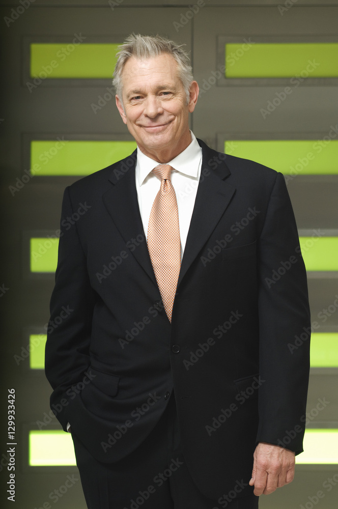 Portrait of a confident senior businessman smiling Portrait of a confident senior businessman smiling