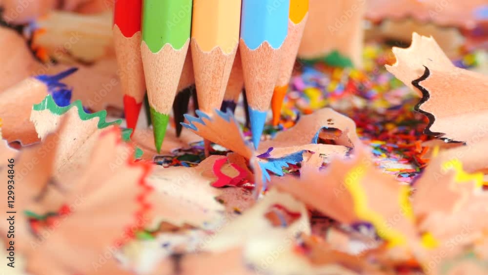 Bunch of colorful pencils standing on their sharp ends among curly pencil chips, creativity, imagination in art. Close up, seamless loop, rotation, 4K Ultra HD. Bunch of colorful pencils standing on their sharp ends among curly pencil chips, creativity, imagination in art. Close up, seamless loop, rotation, 4K Ultra HD.